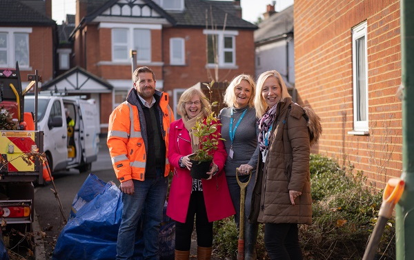 Colleagues tidying up outdoors